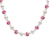 Necklace with alternating white pearls and pink porcelain beads on a white background