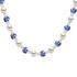 Necklace with alternating white pearls and blue porcelain beads on a white background