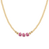 Gold necklace with three pink porcelain beads on a white background