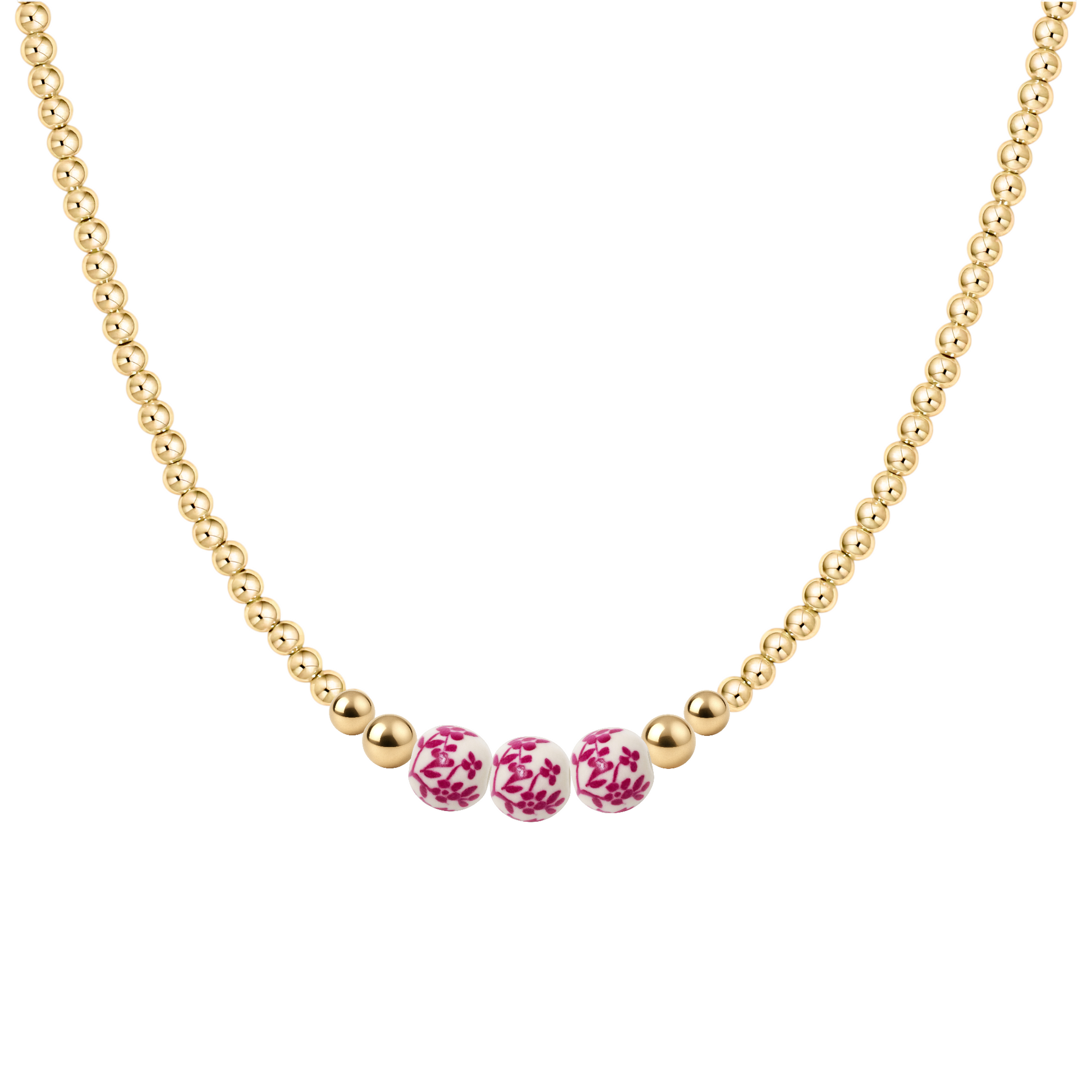 Gold necklace with three pink porcelain beads on a white background