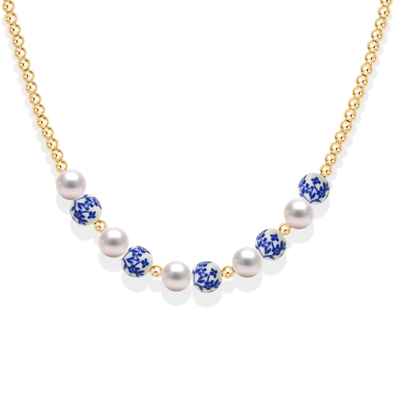 Necklace with pearls and blue porcelain beads on a white background