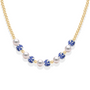 Necklace with pearls and blue porcelain beads on a white background