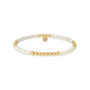 Bracelet with gold and pearl beads on a white background