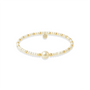 Pearl and gold beaded bracelet on a white background