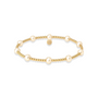 Gold beaded bracelet with pearls on a white background