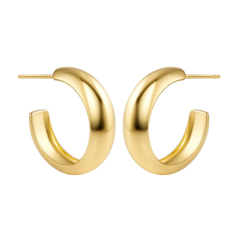 Gold hoop earrings on a white background