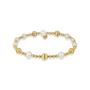 Bracelet with gold beads and pearls on a white background