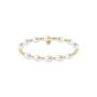 Pearl beaded bracelet with gold accents on a white background