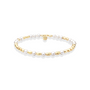 Pearl and gold beaded bracelet on a white background