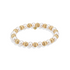 Bracelet with alternating gold and pearl beads on a white background