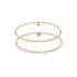 Two pearl bracelets on a gold beaded bracelet against a white background