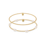 Two pearl bracelets on a gold beaded bracelet against a white background