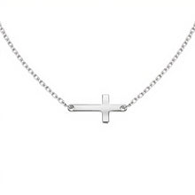 Silver cross necklace on a white background