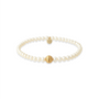 Pearl beaded bracelet with gold accents on a white background