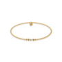 Gold beaded bracelet with a pearl on a white background