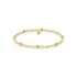 Gold and pearl beaded bracelet on a white background
