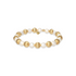 Bracelet with gold and pearl beads on a white background