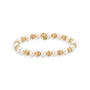 Pearl and gold beaded bracelet on a white background
