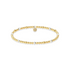 Gold and pearl beaded bracelet on a white background