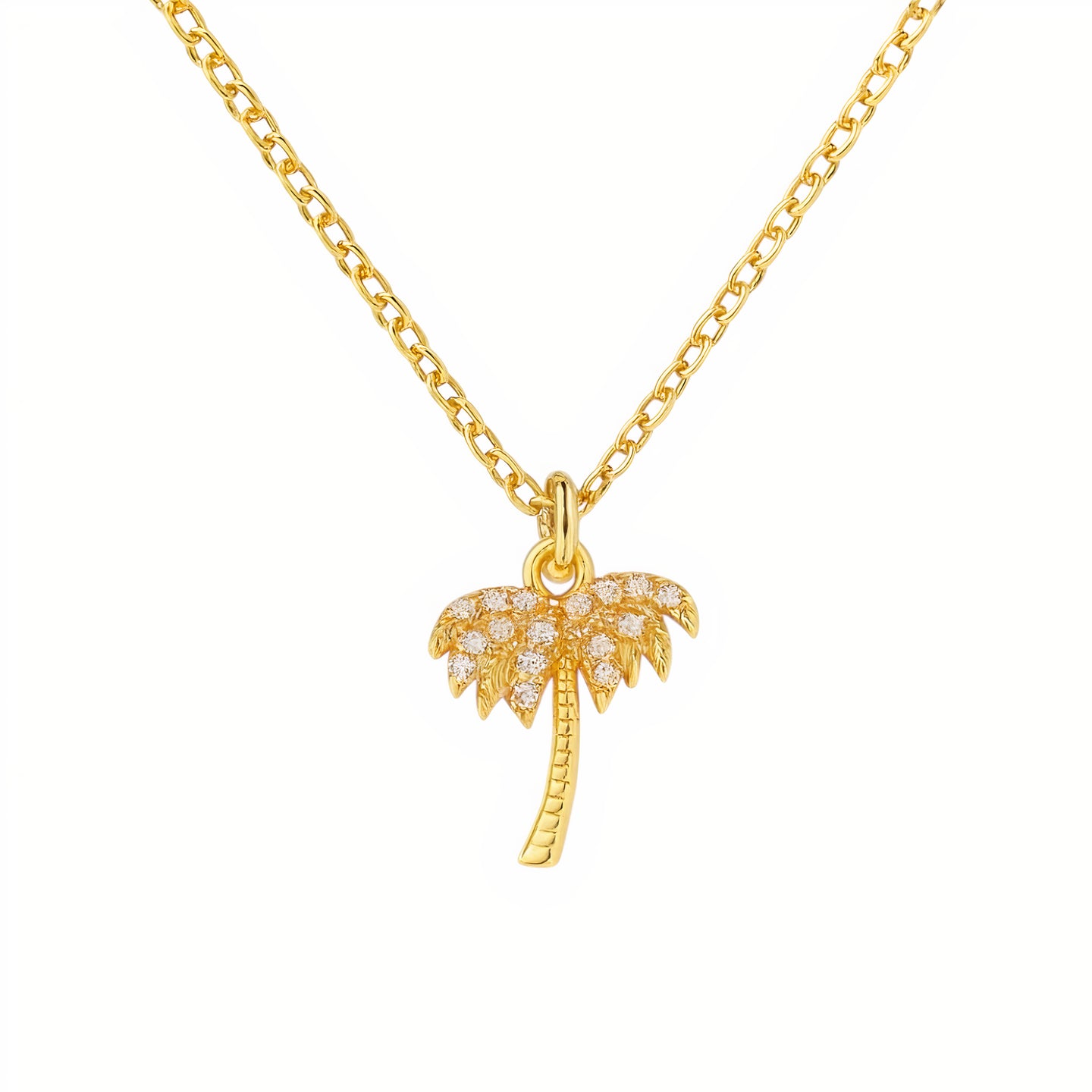 Gold palm tree necklace on a white background