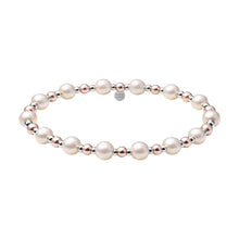 Pearl bracelet with silver and rose gold accents on a white background
