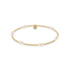 Gold beaded bracelet with pearls on a white background