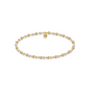 Pearl and gold beaded bracelet on a white background