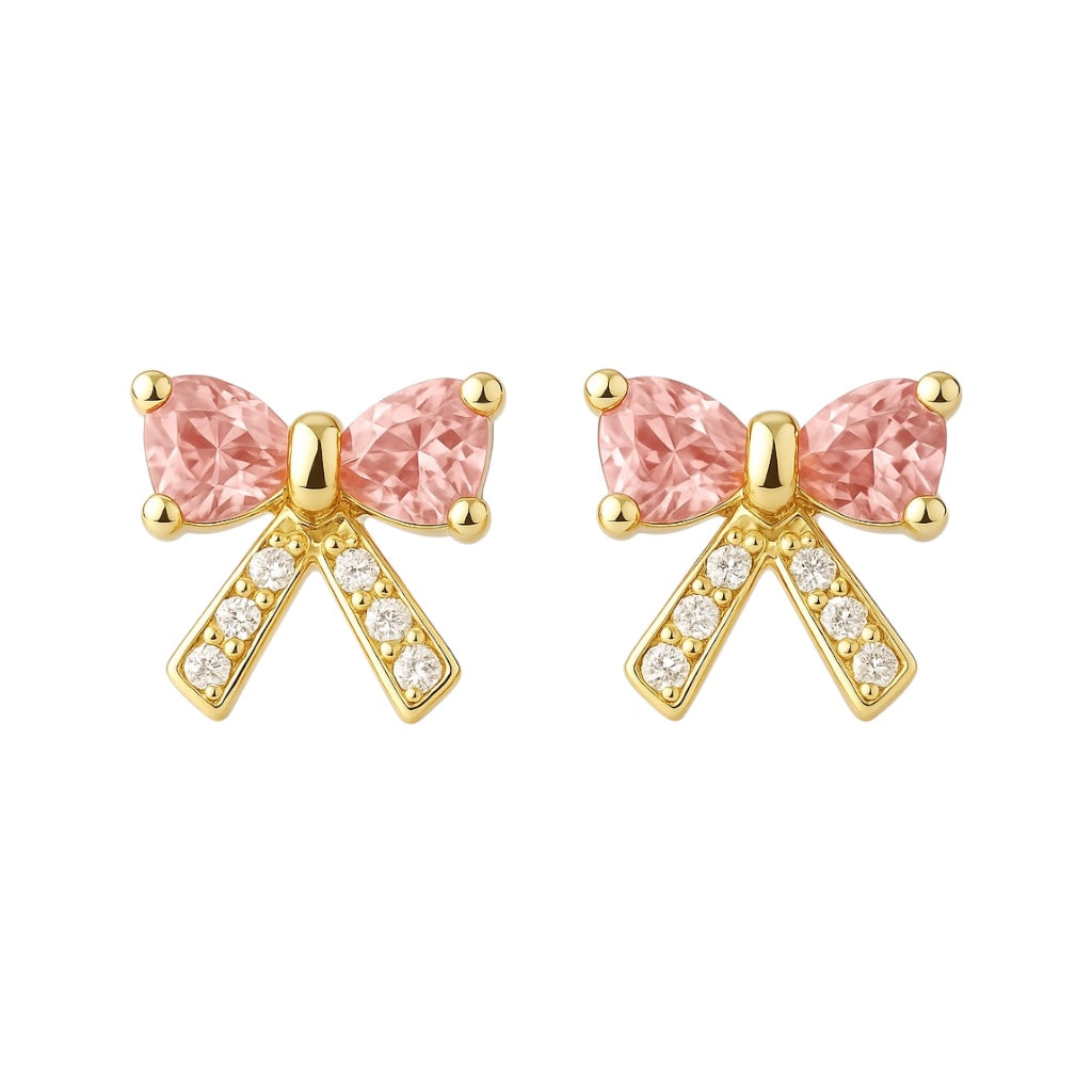 Gold bow-shaped earrings with pink gemstones on a white background
