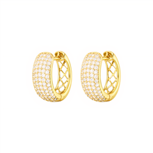 Gold hoop earrings with clear gemstones on a white background