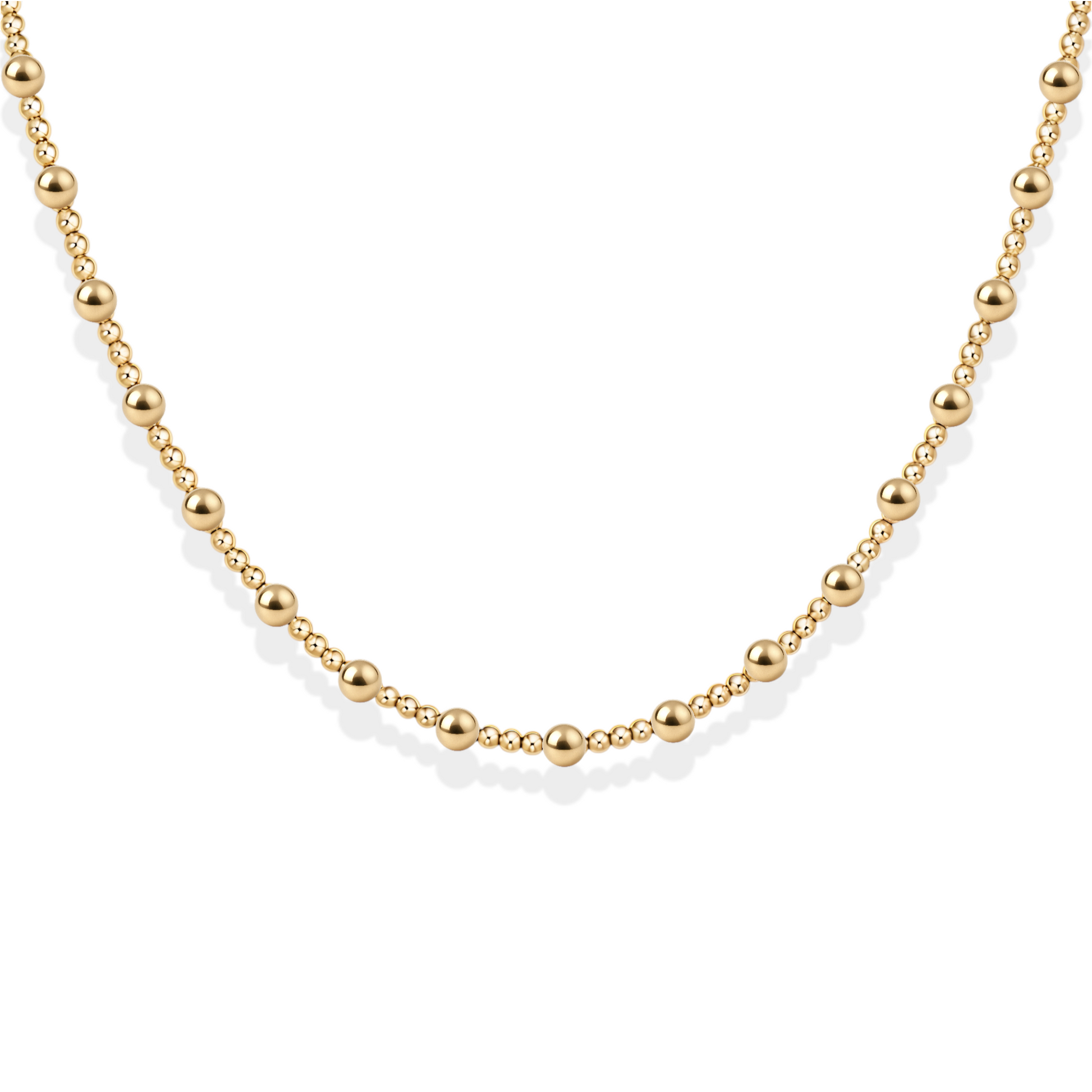 Gold beaded necklace on a white background