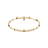 Gold beaded bracelet on a white background
