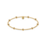 Gold beaded bracelet on a white background