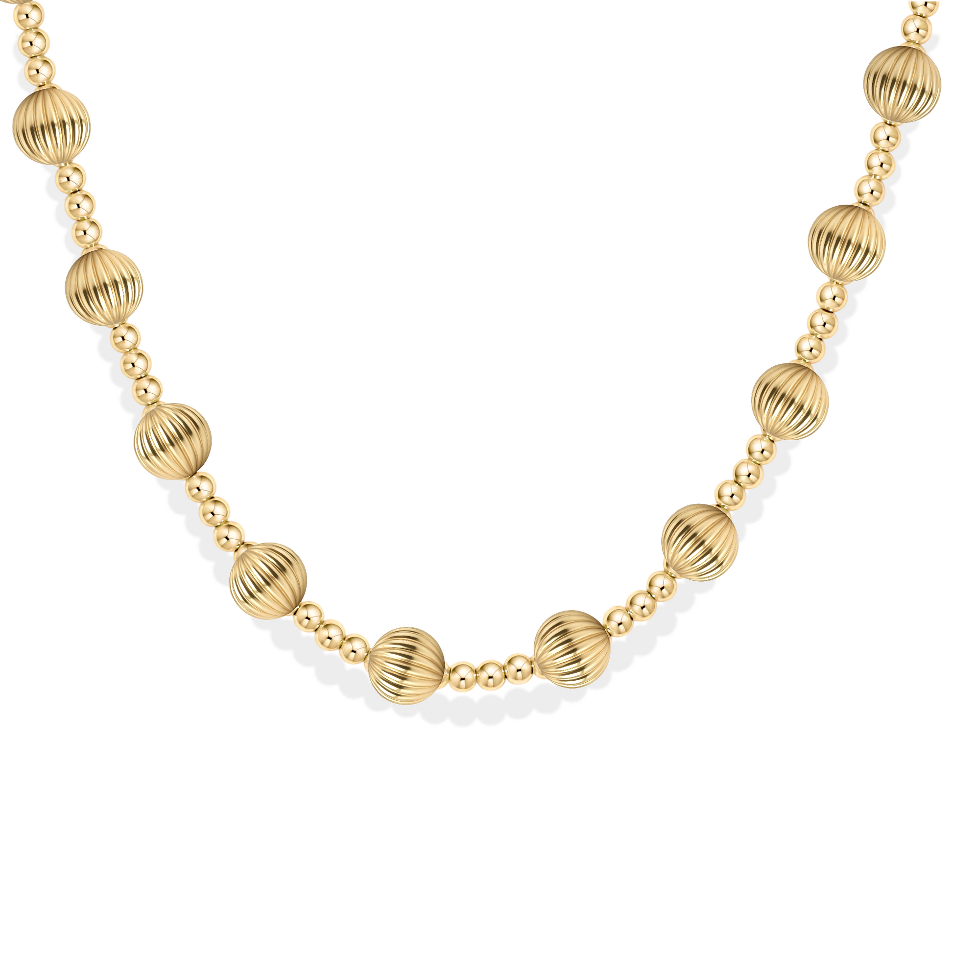 Gold necklace with round beads on a white background