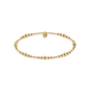 Gold beaded bracelet on a white background