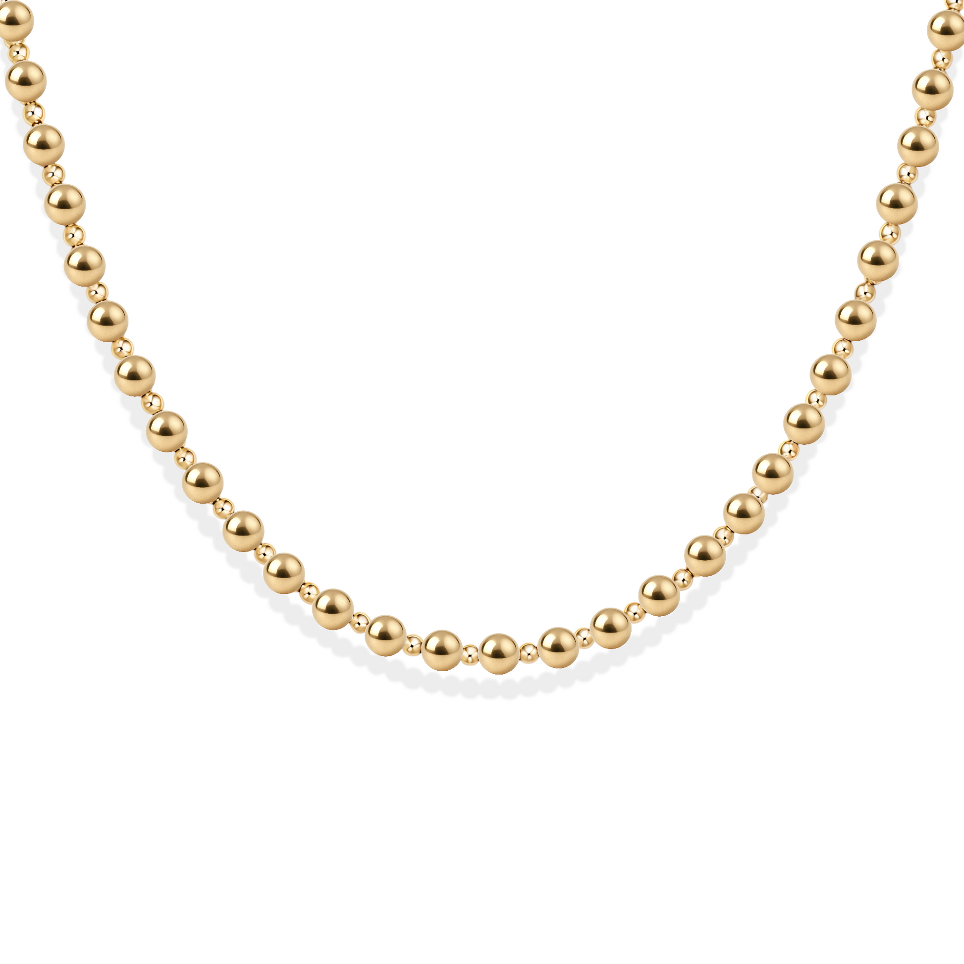 Gold beaded necklace on a white background