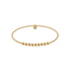 Gold beaded bracelet on a white background