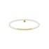 Pearl and gold beaded bracelet on a white background