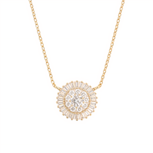 Gold necklace with a diamond pendant on a white background