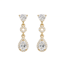 Gold and diamond earrings on a white background