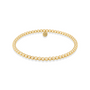 Gold beaded bracelet on a white background